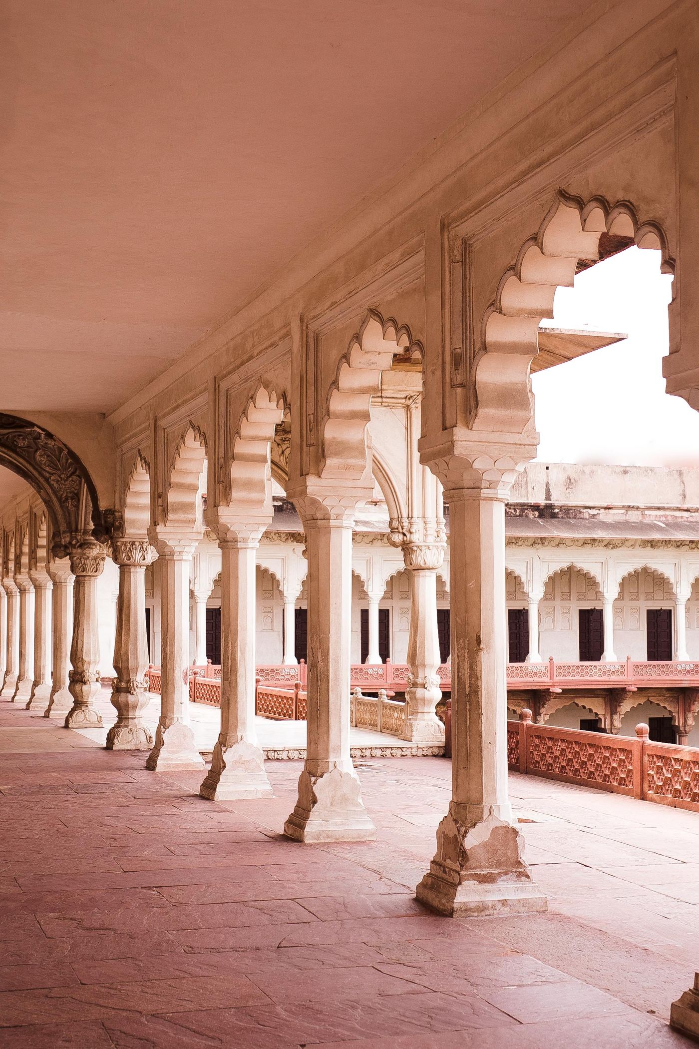 Classical Indian civic architecture with columns and arches, evoking the courts